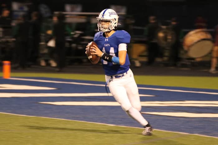 Johnny DiBlasio rolls out to attempt a pass for Hilliard Davidson (photo courtesy of the DiBlasio family)